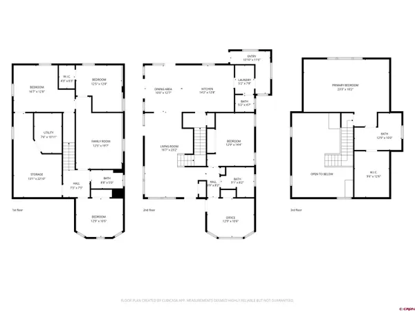 a white wall with picture on the wall and white kitchen