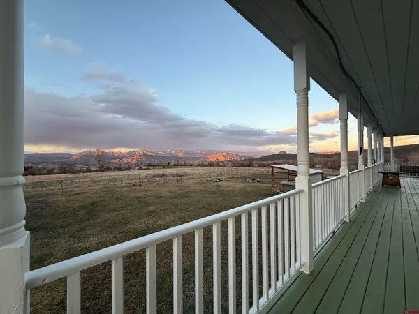 a view of city and mountain from a balcony