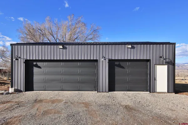a wooden door in front of a house