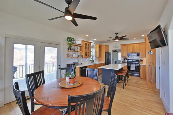 a view of a dining room with furniture window and wooden floor
