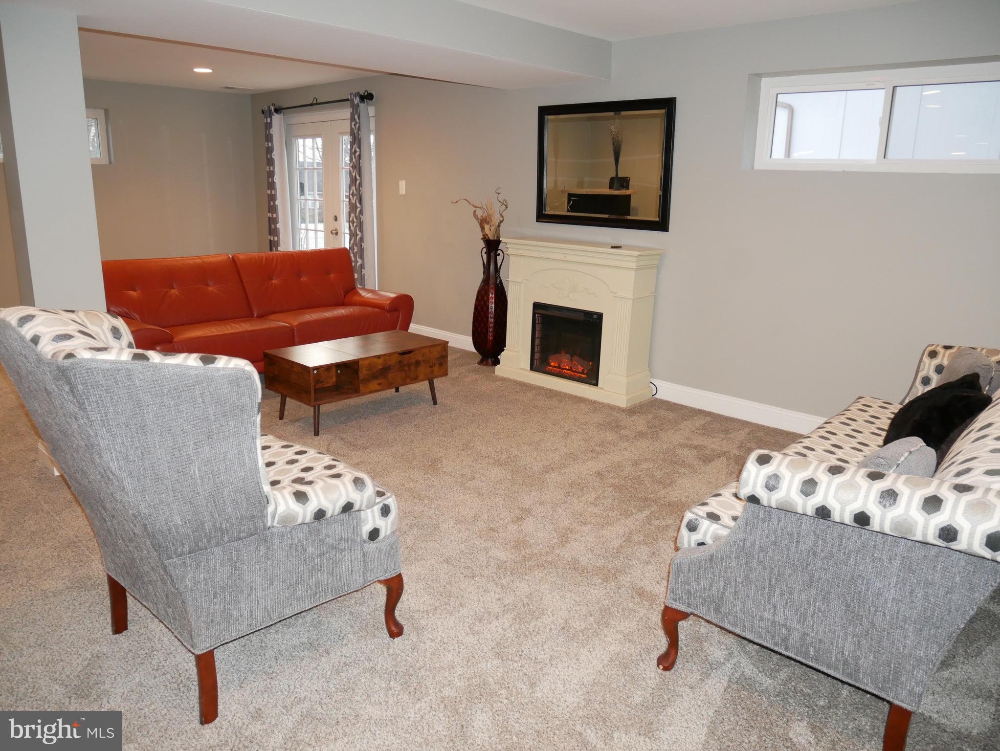 1805 Arcola Avenue, Unit A Silver Spring, MD 20902 - Photo 11 of 29 a living room with furniture and a fireplace