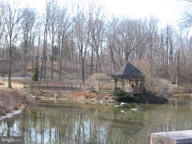 a view of a lake with a house in the background