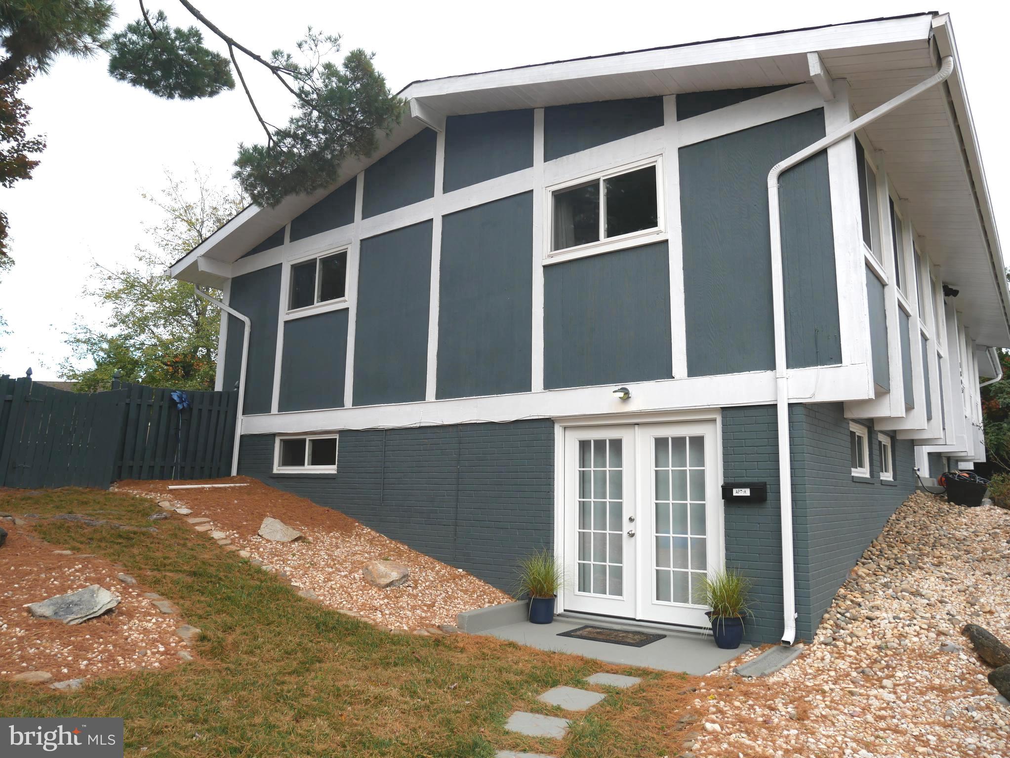 1805 Arcola Avenue, Unit A Silver Spring, MD 20902 - Photo 3 of 29 a view of a house with a door and wooden fence