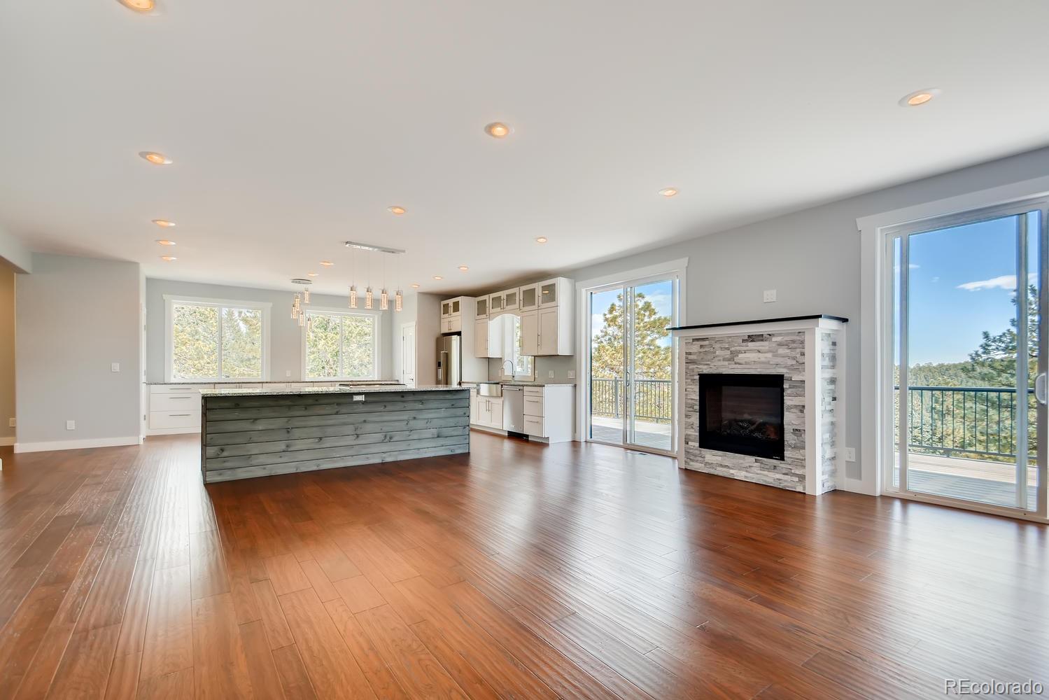 5967 High Drive Morrison, CO 80465 - Photo 15 of 38 a room with fireplace and wooden floor