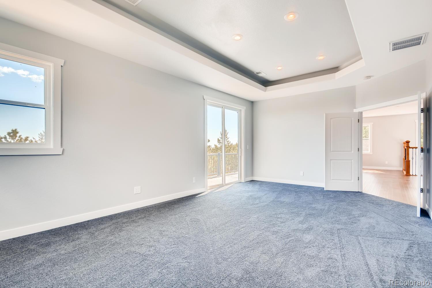 5967 High Drive Morrison, CO 80465 - Photo 19 of 38 an empty room with windows and closet