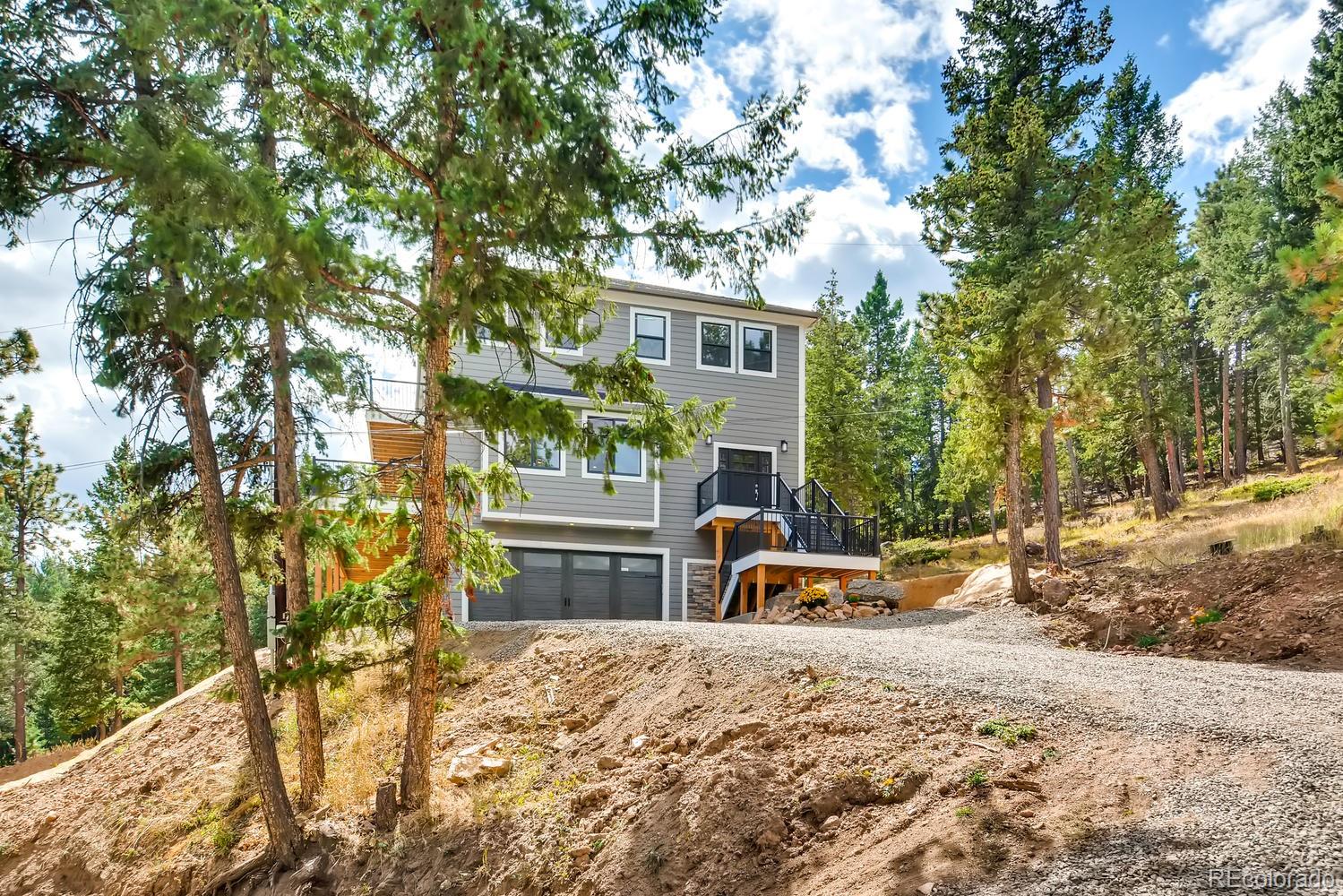 5967 High Drive Morrison, CO 80465 - Photo 2 of 38 a view of a house with backyard and sitting area