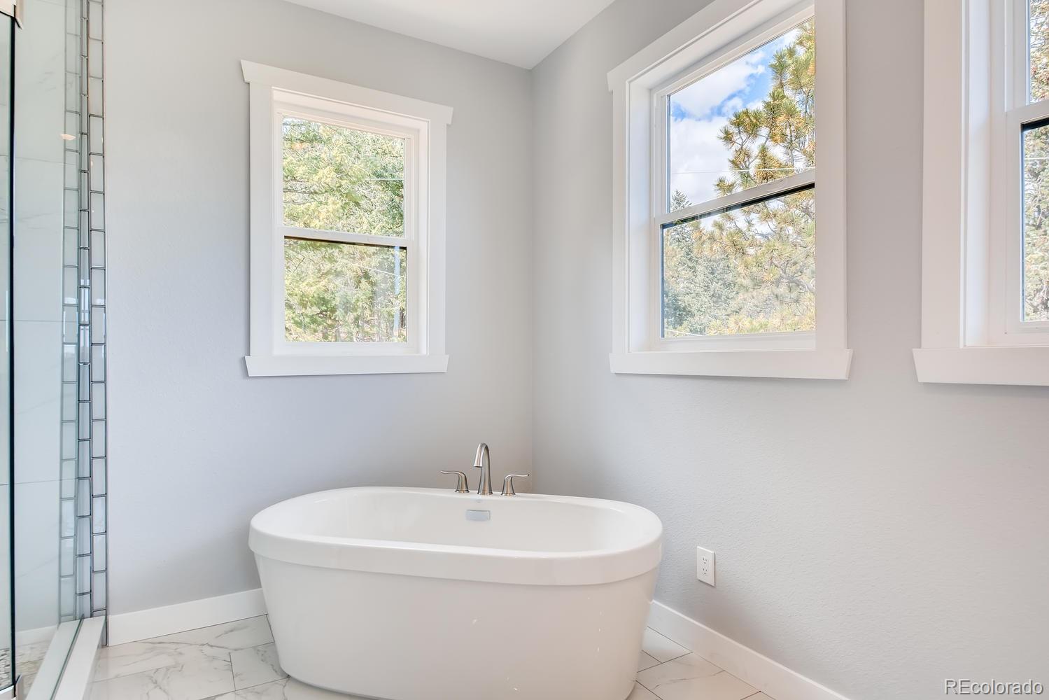 5967 High Drive Morrison, CO 80465 - Photo 24 of 38 a white bath tub sitting next to a white sink
