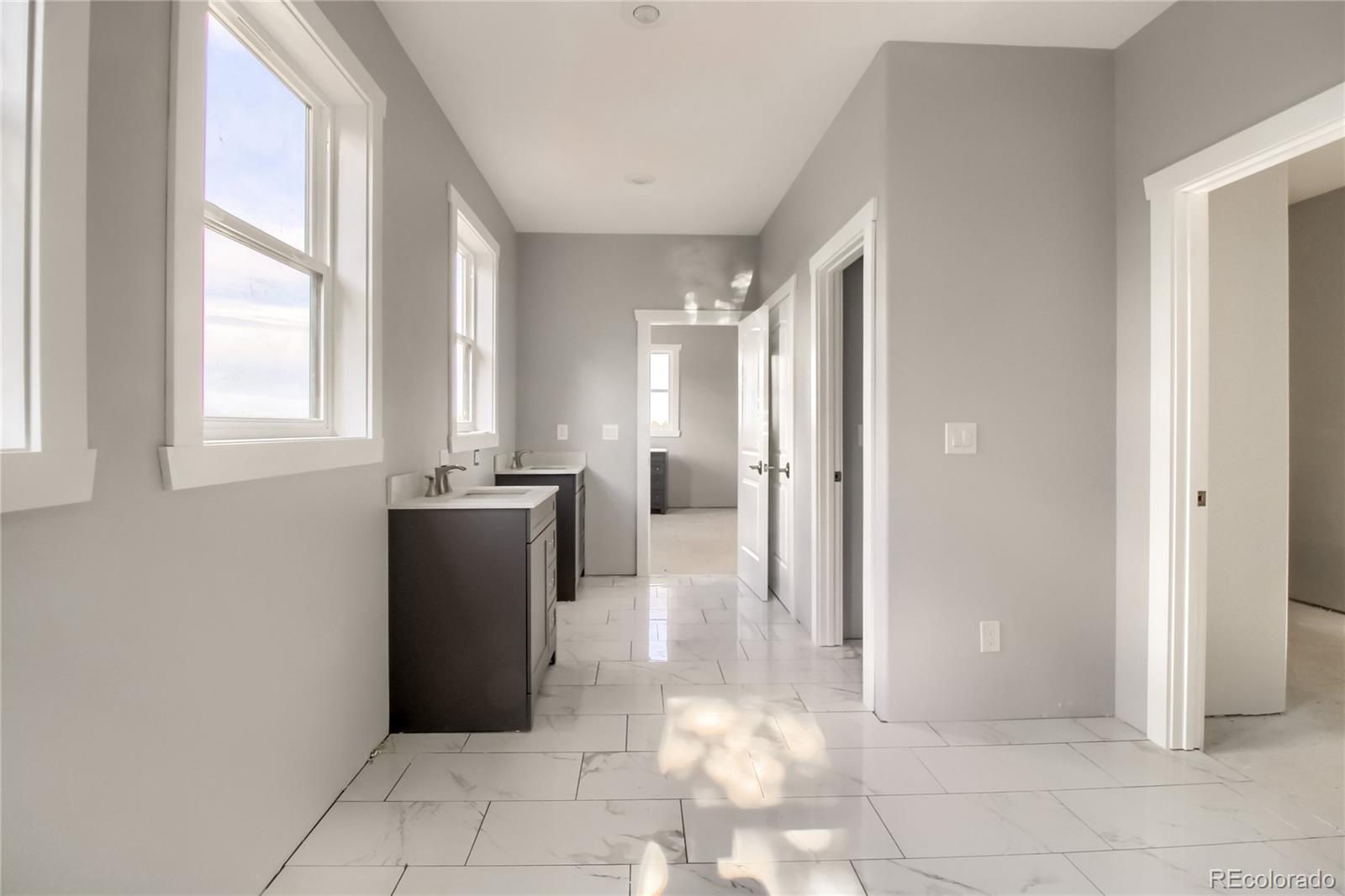 5967 High Drive Morrison, CO 80465 - Photo 26 of 38 a view of a hallway with a dining table and a window