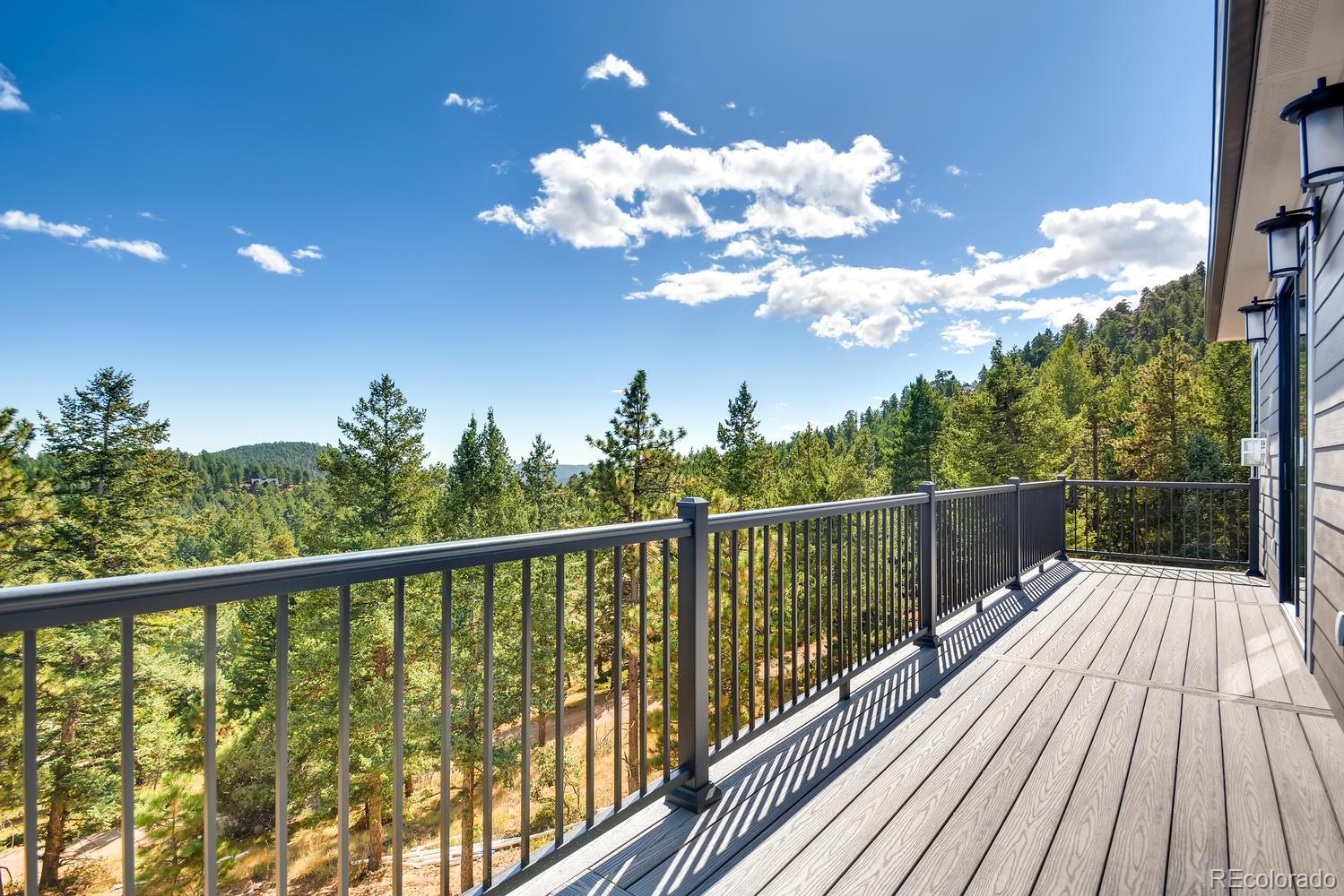 5967 High Drive Morrison, CO 80465 - Photo 31 of 38 a view of a balcony with wooden floor