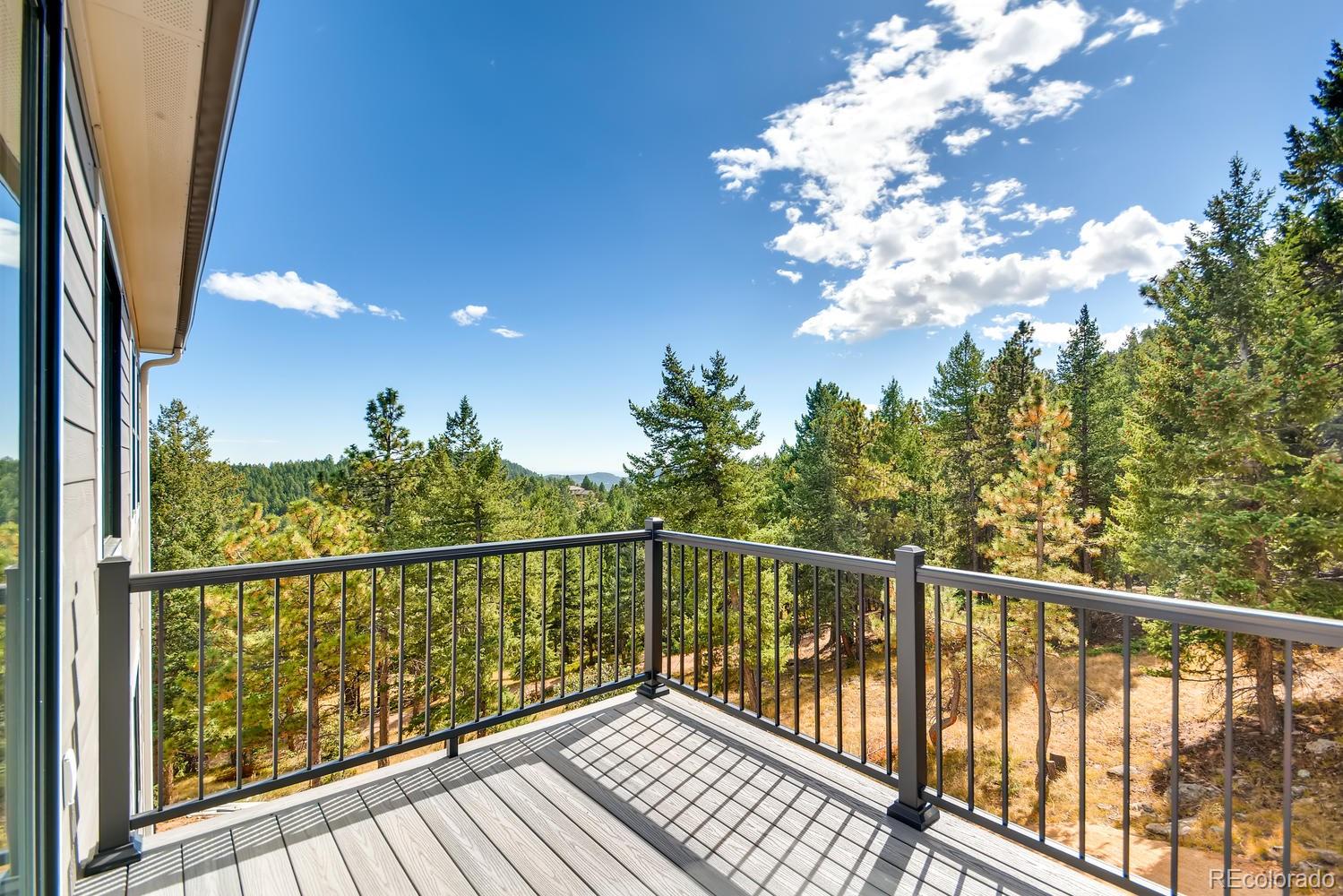 5967 High Drive Morrison, CO 80465 - Photo 32 of 38 a view of a balcony with wooden floor