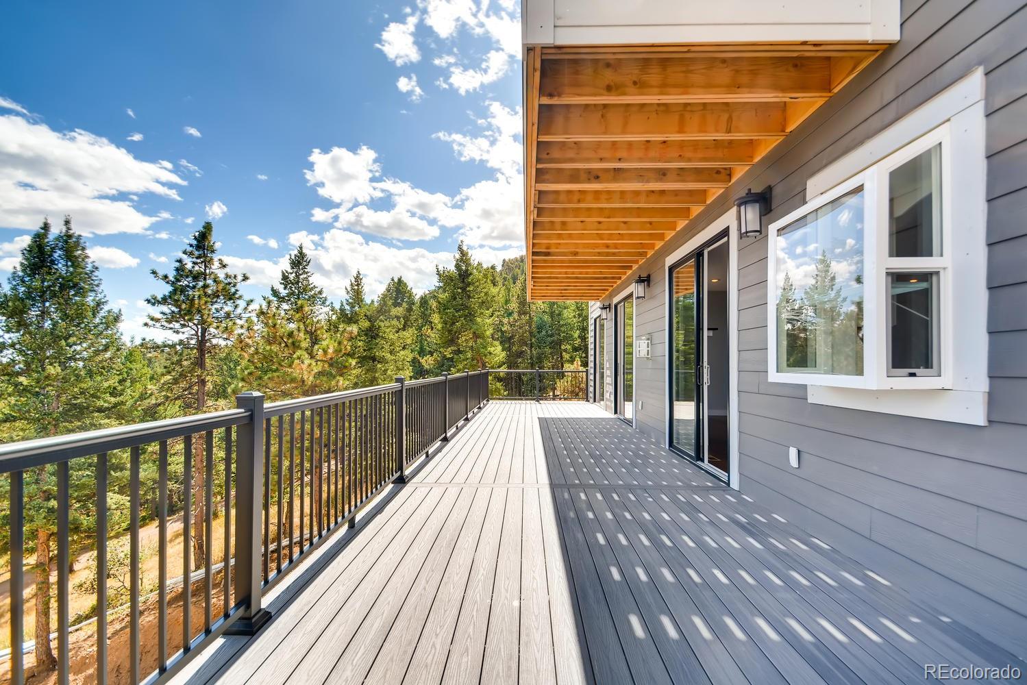 5967 High Drive Morrison, CO 80465 - Photo 34 of 38 a view of a balcony with wooden floor