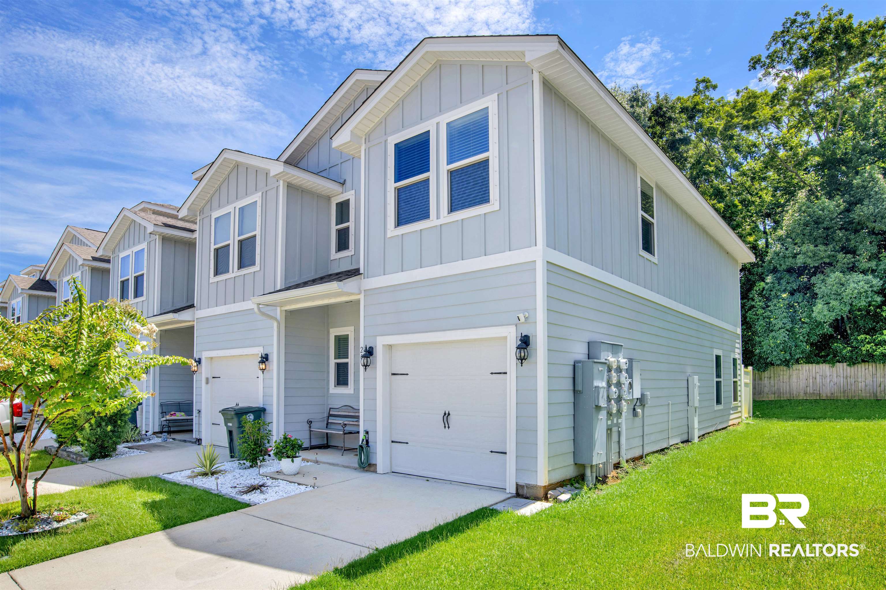 25806 Pollard Road, Unit 20 Daphne, AL 36526 - Photo 2 of 29 View of front facade with a garage and a front yard