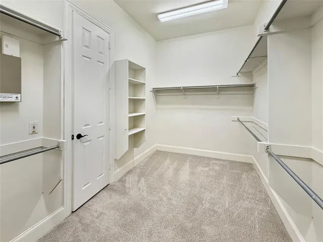 a view of an empty walk in closet