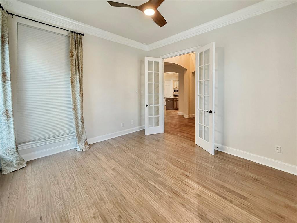 3779 Navarro Way Frisco, TX 75034 - Photo 16 of 17 an empty room with wooden floor a ceiling fan