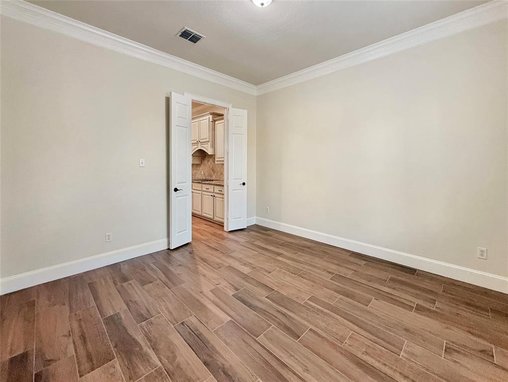 3779 Navarro Way Frisco, TX 75034 - Photo 6 of 17 a view of an empty room with wooden floor and closet