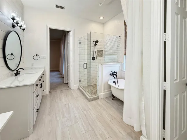 a bathroom with a double vanity sink and a mirror