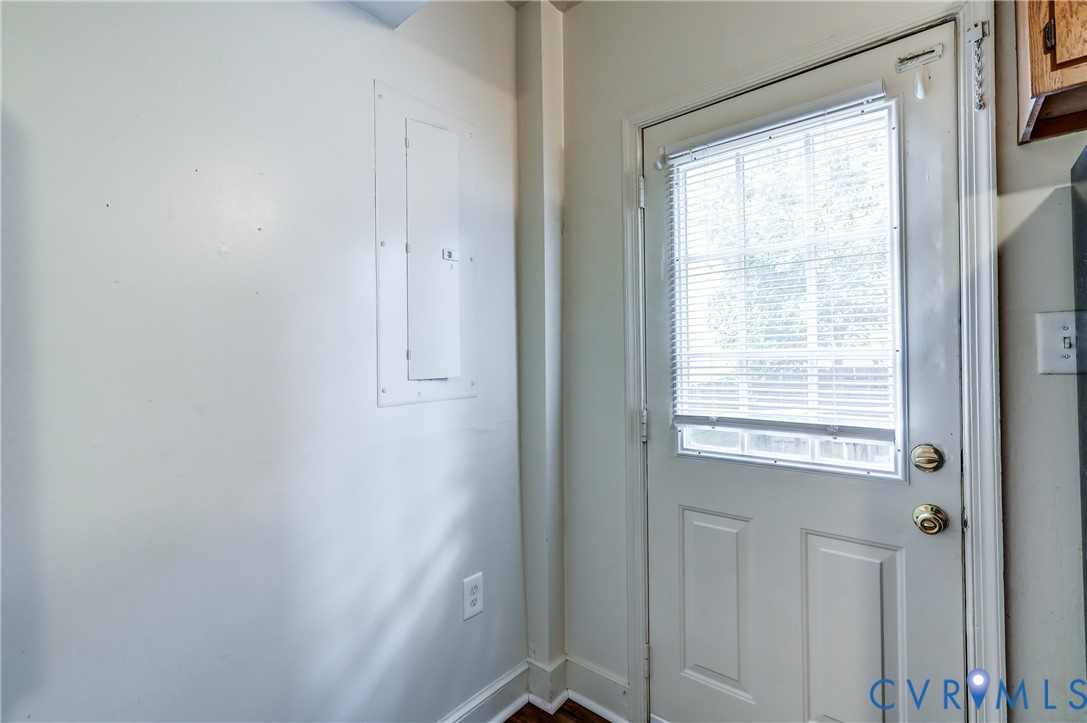 818 Spring Street Richmond, VA 23220 - Photo 12 of 28 a view of an empty room with wooden floor and a window