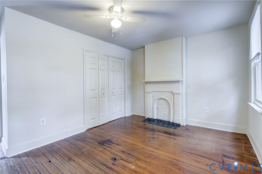 818 Spring Street Richmond, VA 23220 - Photo 18 of 28 a view of empty room with wooden floor and fan