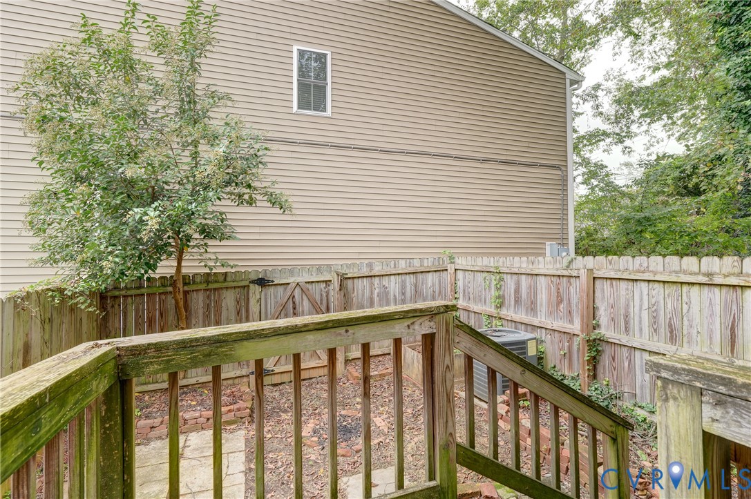 818 Spring Street Richmond, VA 23220 - Photo 22 of 28 a view of a balcony with lake and trees