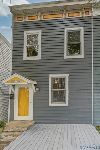 a view of a house with wooden floor and a window