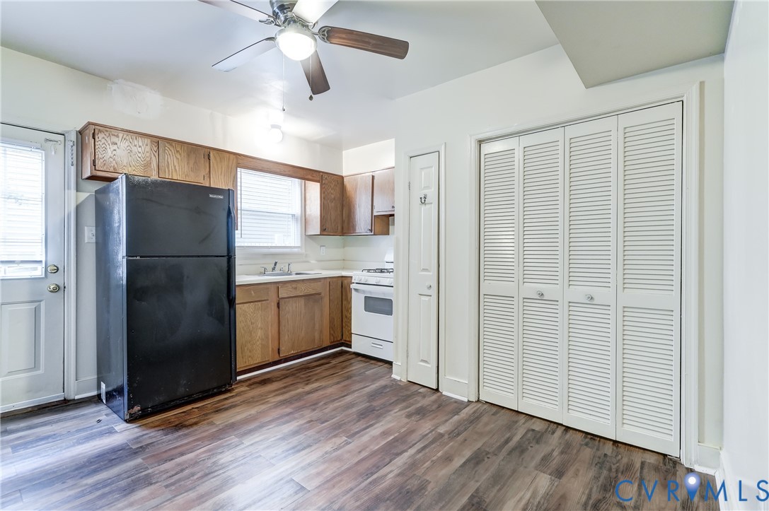 818 Spring Street Richmond, VA 23220 - Photo 10 of 28 a kitchen with a refrigerator and a sink
