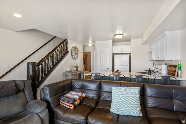 3598 North Huntsman Path, Unit 502 Eden, UT 84310 - Photo 3 of 43 Living room featuring stairway