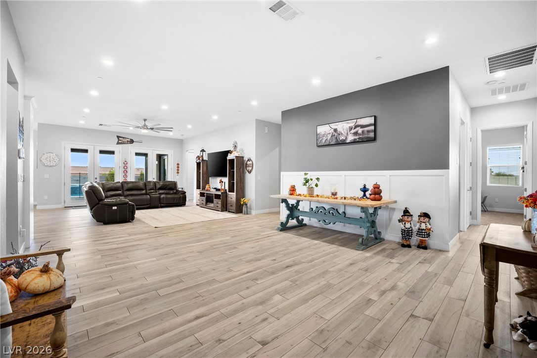 432 North Racetrack Road Henderson, NV 89015 - Photo 31 of 45 Living room with light wood-style floors, a ceiling fan, and recessed lighting