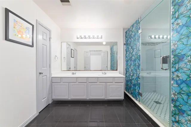 a bathroom with a bathtub and a sink