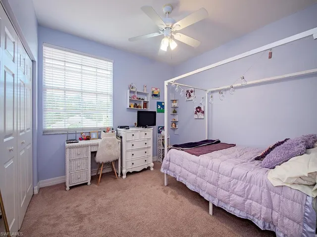 a bedroom with bed and window