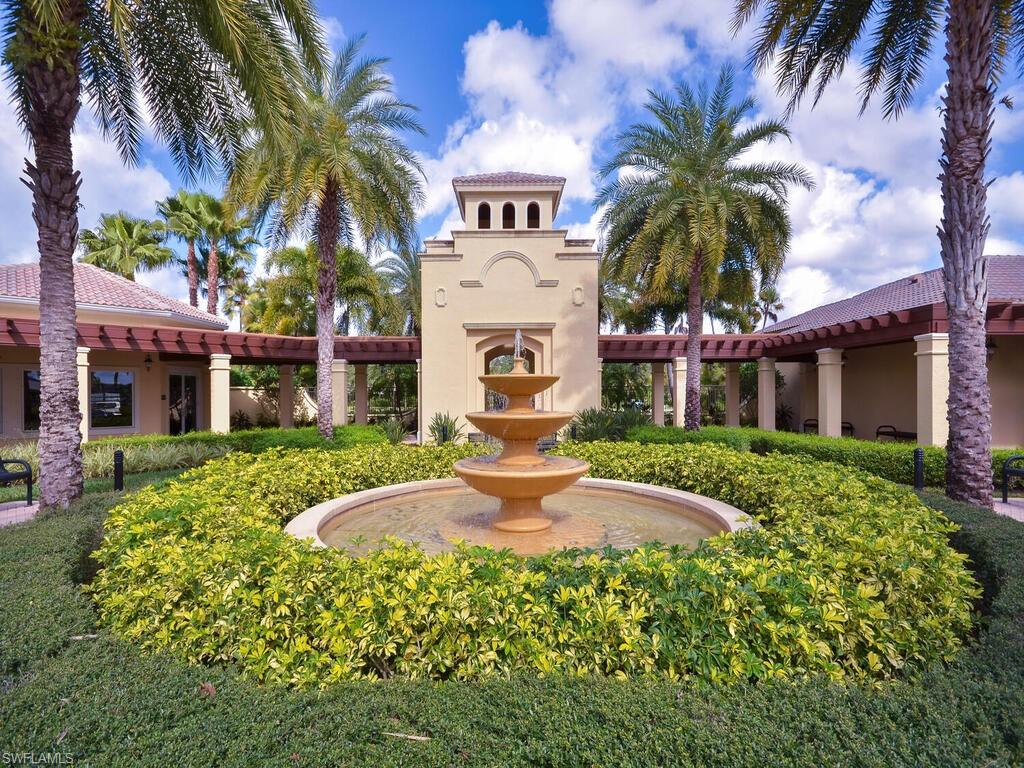 2346 Butterfly Palm Drive Naples, FL 34119 - Photo 17 of 45 View of community featuring a patio area