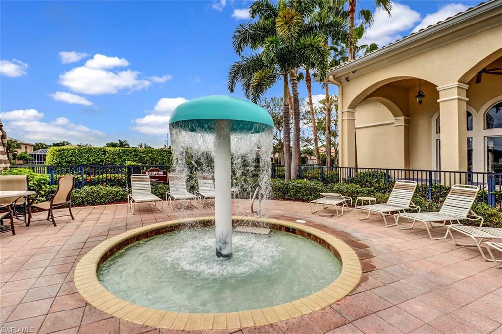 2346 Butterfly Palm Drive Naples, FL 34119 - Photo 30 of 45 View of community featuring a patio