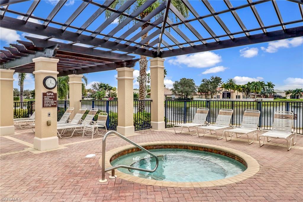 2346 Butterfly Palm Drive Naples, FL 34119 - Photo 31 of 45 View of swimming pool featuring a community hot tub and a patio area