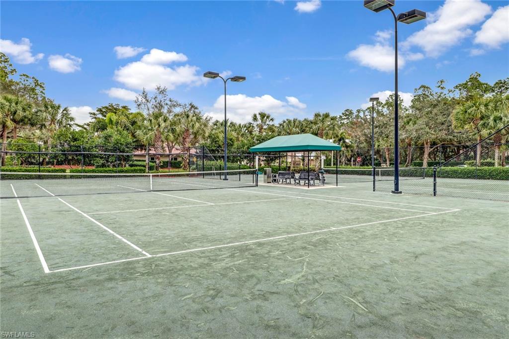 2346 Butterfly Palm Drive Naples, FL 34119 - Photo 34 of 45 View of tennis court featuring community basketball court and view of scattered trees