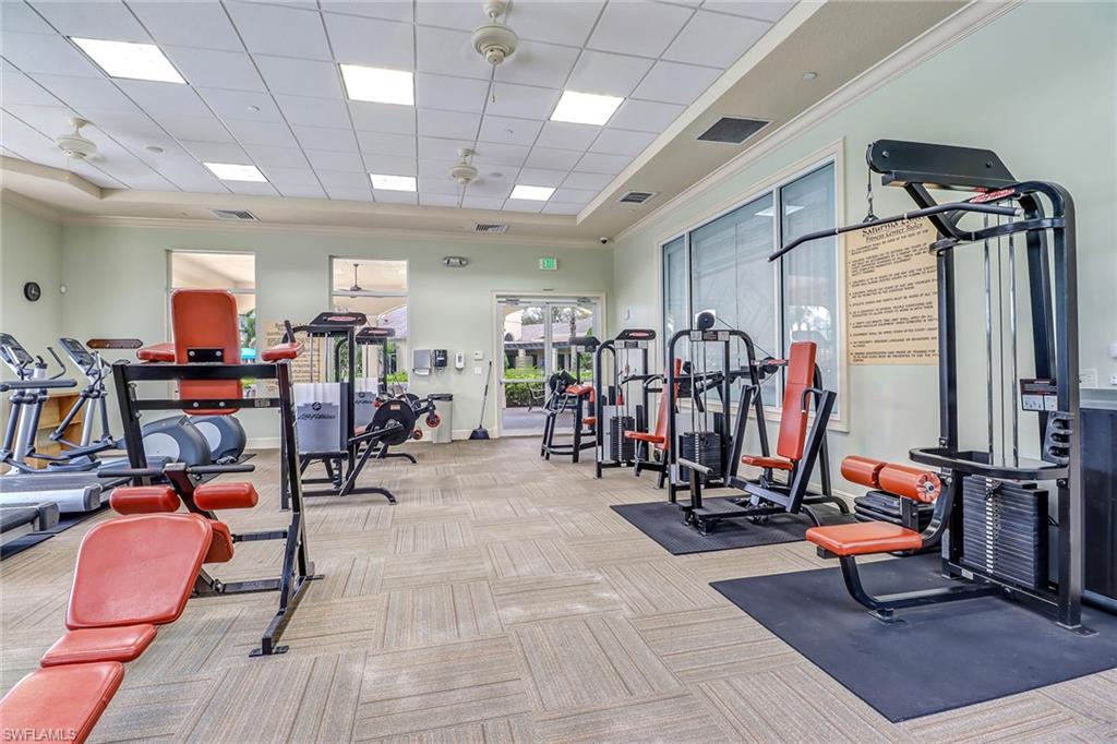 2346 Butterfly Palm Drive Naples, FL 34119 - Photo 39 of 45 Exercise room with crown molding and a drop ceiling
