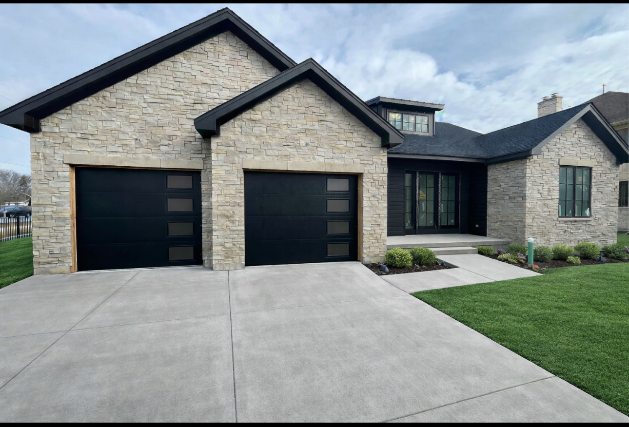 1435 Pfingsten Road Northbrook, IL 60062 - Photo 1 of 17 a front view of a house with yard and garage