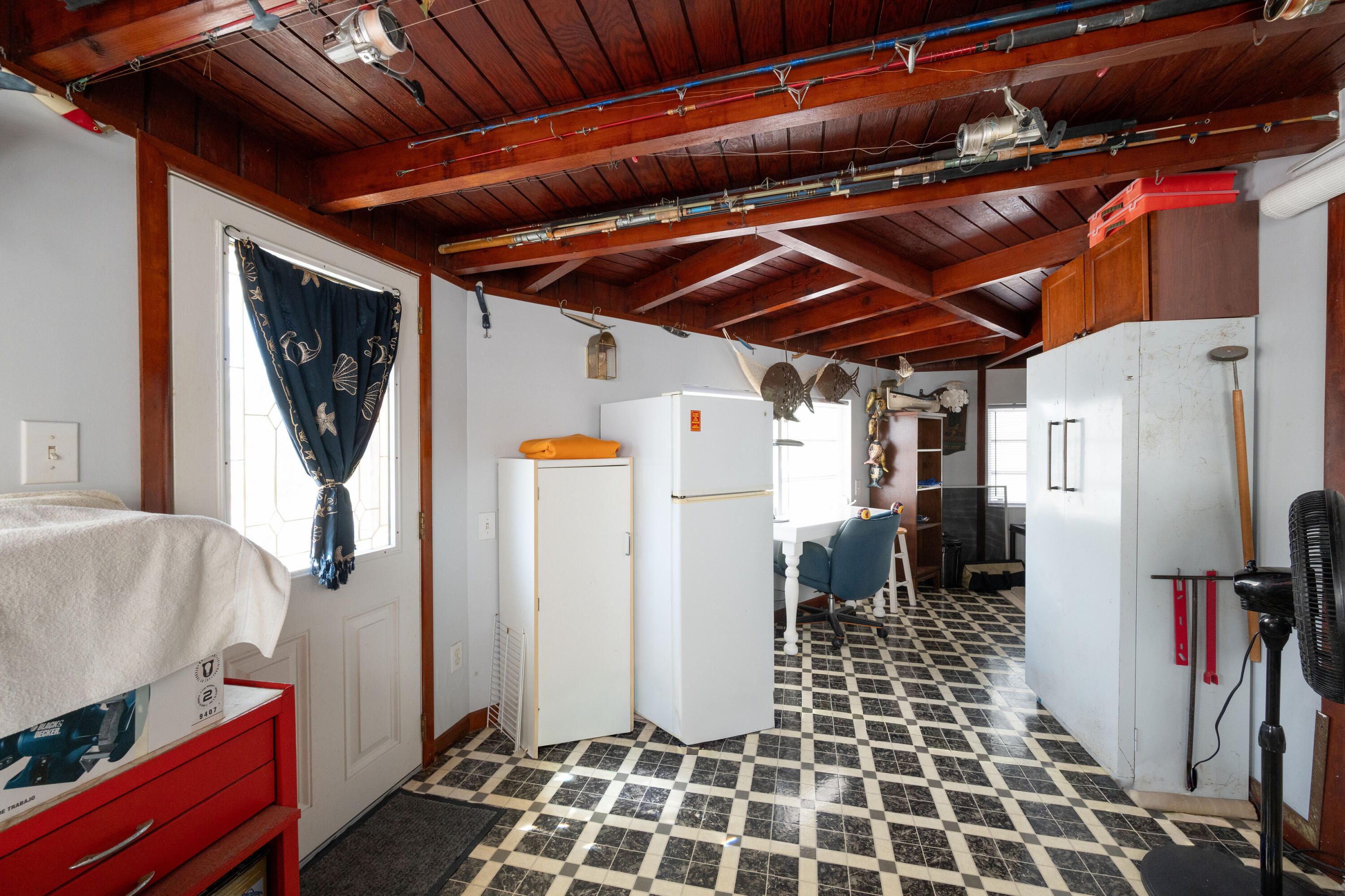138 Sea Lane Key West, FL 33040 - Photo 17 of 31 a view of a refrigerator with wooden floor