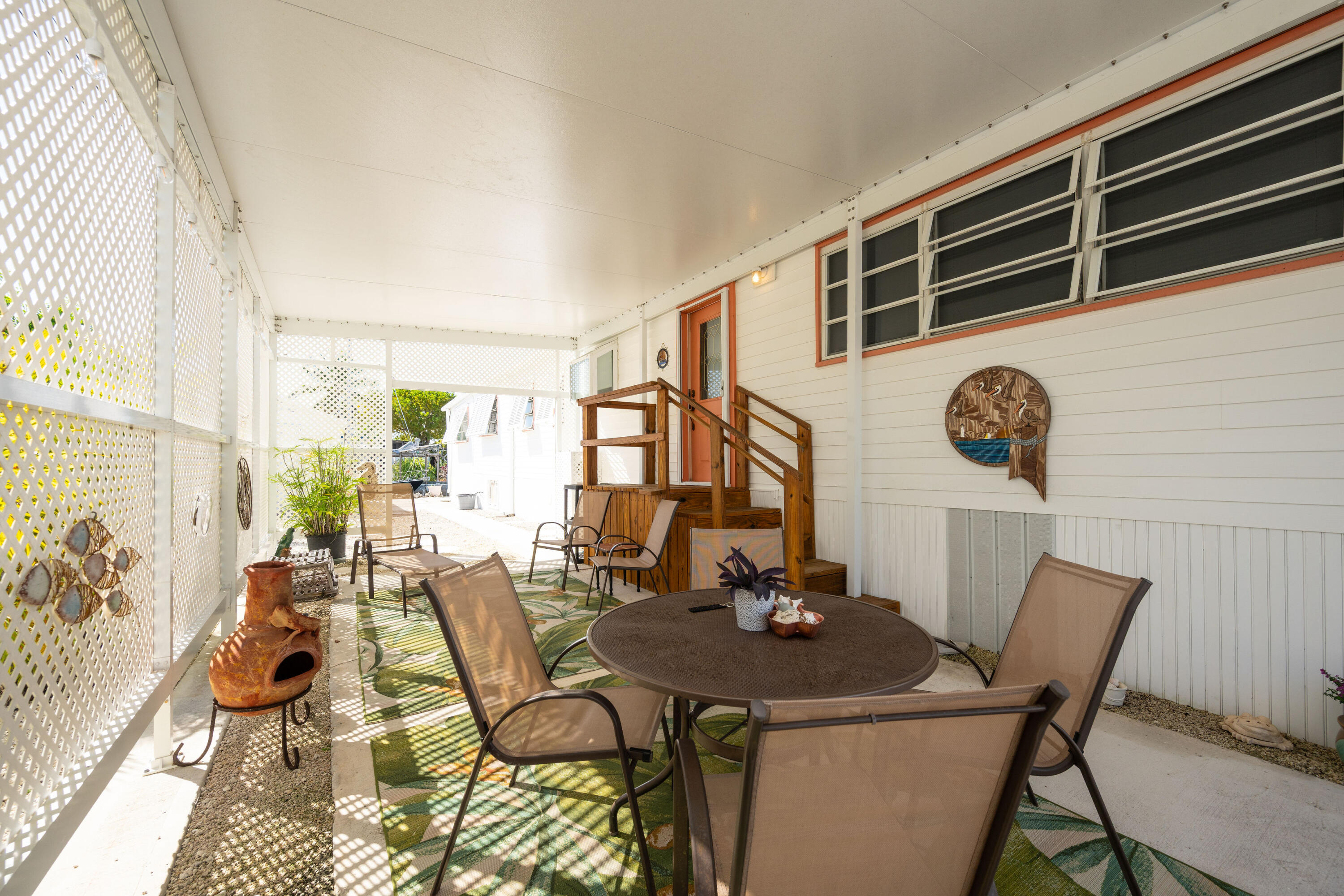 138 Sea Lane Key West, FL 33040 - Photo 21 of 31 a view of a dining room with furniture and chandelier