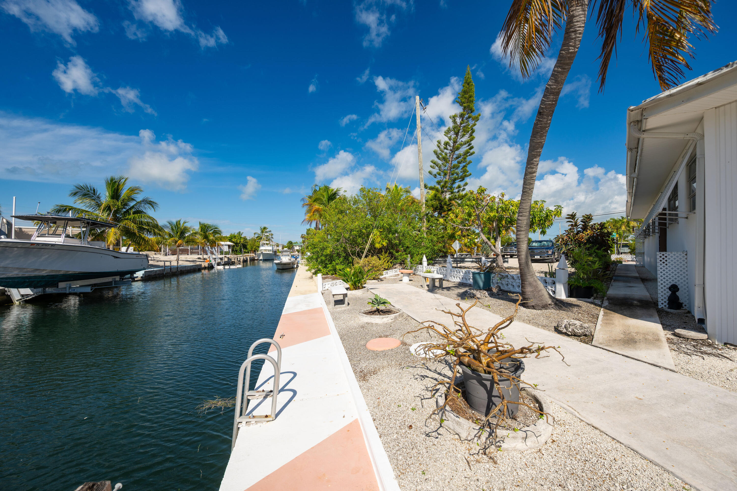 138 Sea Lane Key West, FL 33040 - Photo 27 of 31 a view of a lake with couches and lounge chairs