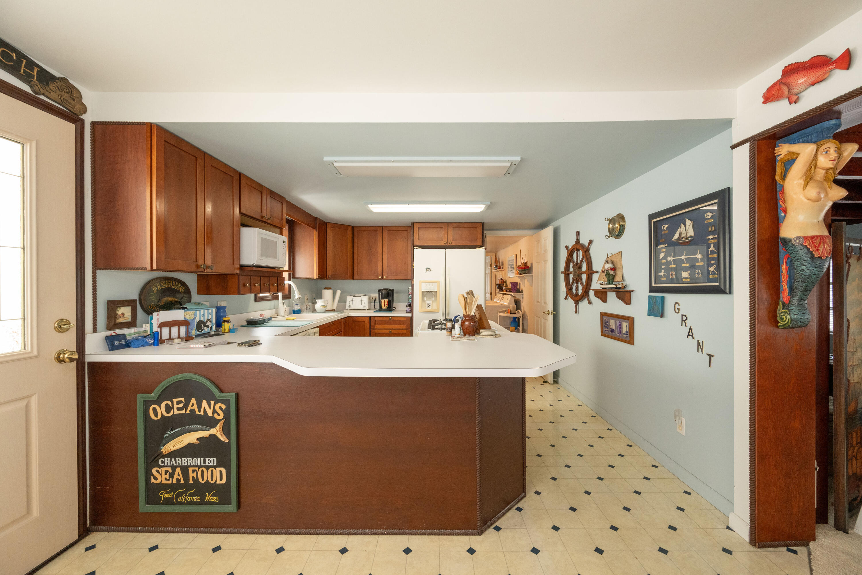 138 Sea Lane Key West, FL 33040 - Photo 6 of 31 a kitchen with sink a refrigerator and cabinets