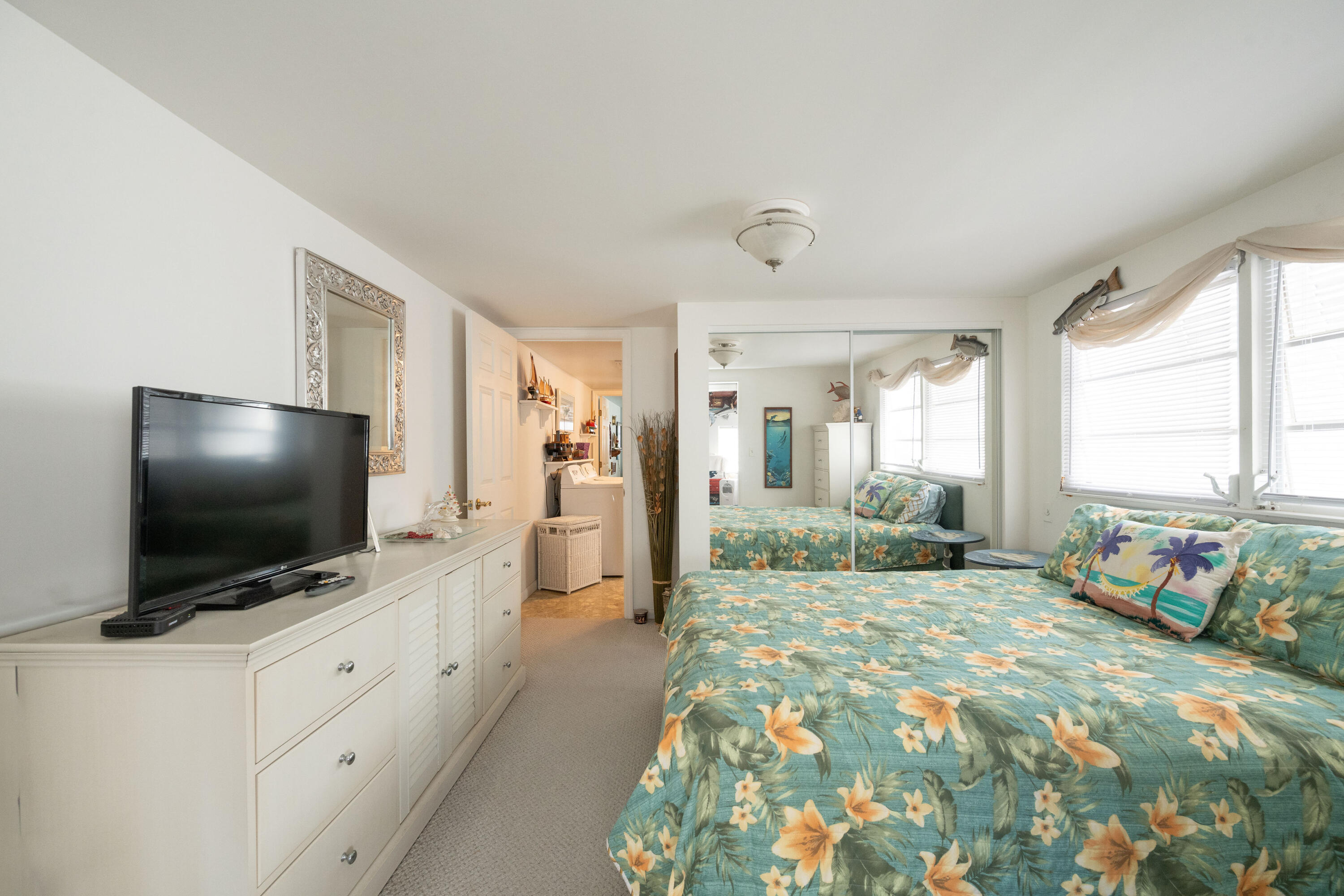 138 Sea Lane Key West, FL 33040 - Photo 10 of 31 a bedroom with furniture and flat screen tv