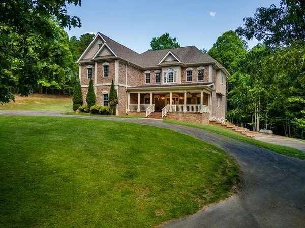 a front view of a house with a yard