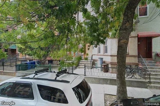 a view of a patio with couches table and chairs and potted plants