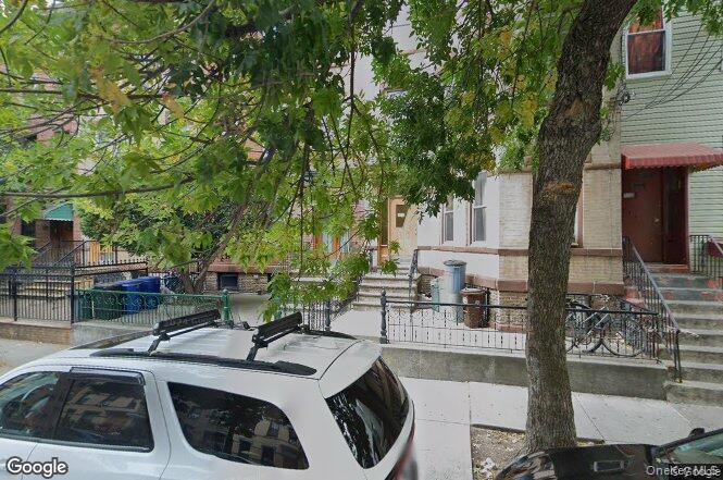 1737 Grove Street Queens, NY 11385 - Photo 6 of 6 a view of a patio with couches table and chairs and potted plants
