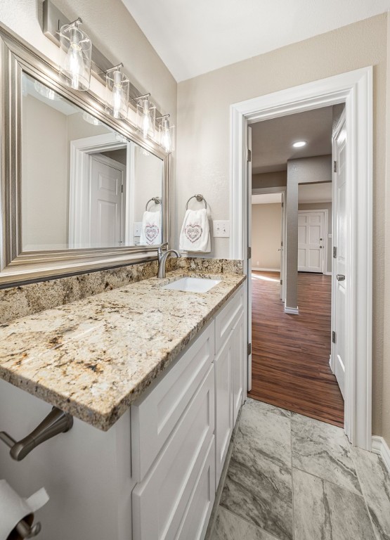 8896 Gholson Road Waco, TX 76705 - Photo 21 of 58 a bathroom with a granite countertop sink and a mirror