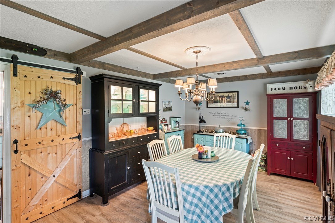 800 Adkins Road Chesterfield, VA 23236 - Photo 2 of 37 a view of a dining room with furniture a chandelier and wooden floor