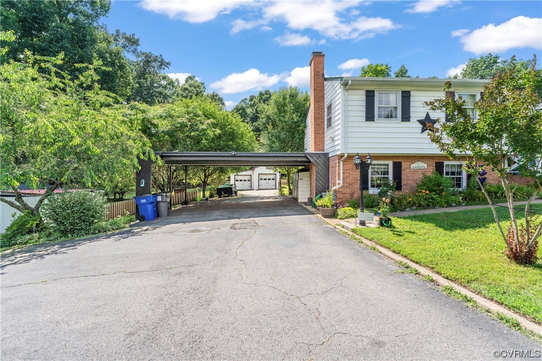 800 Adkins Road Chesterfield, VA 23236 - Photo 25 of 37 a front view of a house with a yard and potted plants