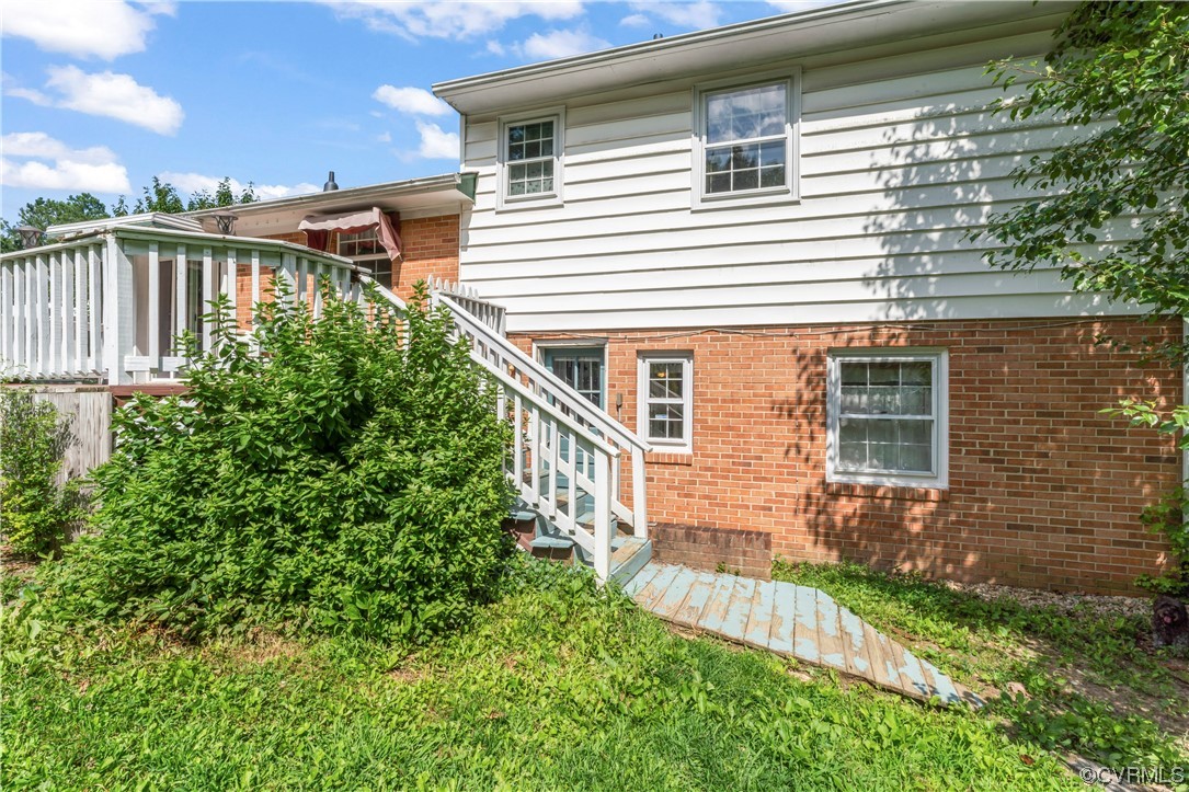 800 Adkins Road Chesterfield, VA 23236 - Photo 35 of 37 a view of a house with brick walls and a yard with plants