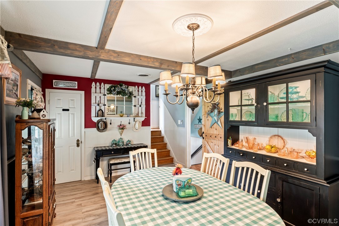 800 Adkins Road Chesterfield, VA 23236 - Photo 4 of 37 a outdoor dining space with furniture chandelier and wooden floor