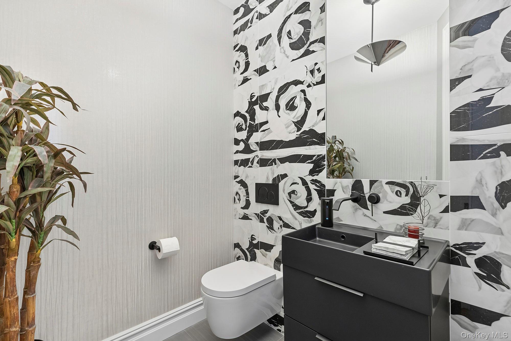 144 Round Swamp Road Huntington, NY 11743 - Photo 12 of 39 a bathroom with a granite countertop sink and a toilet