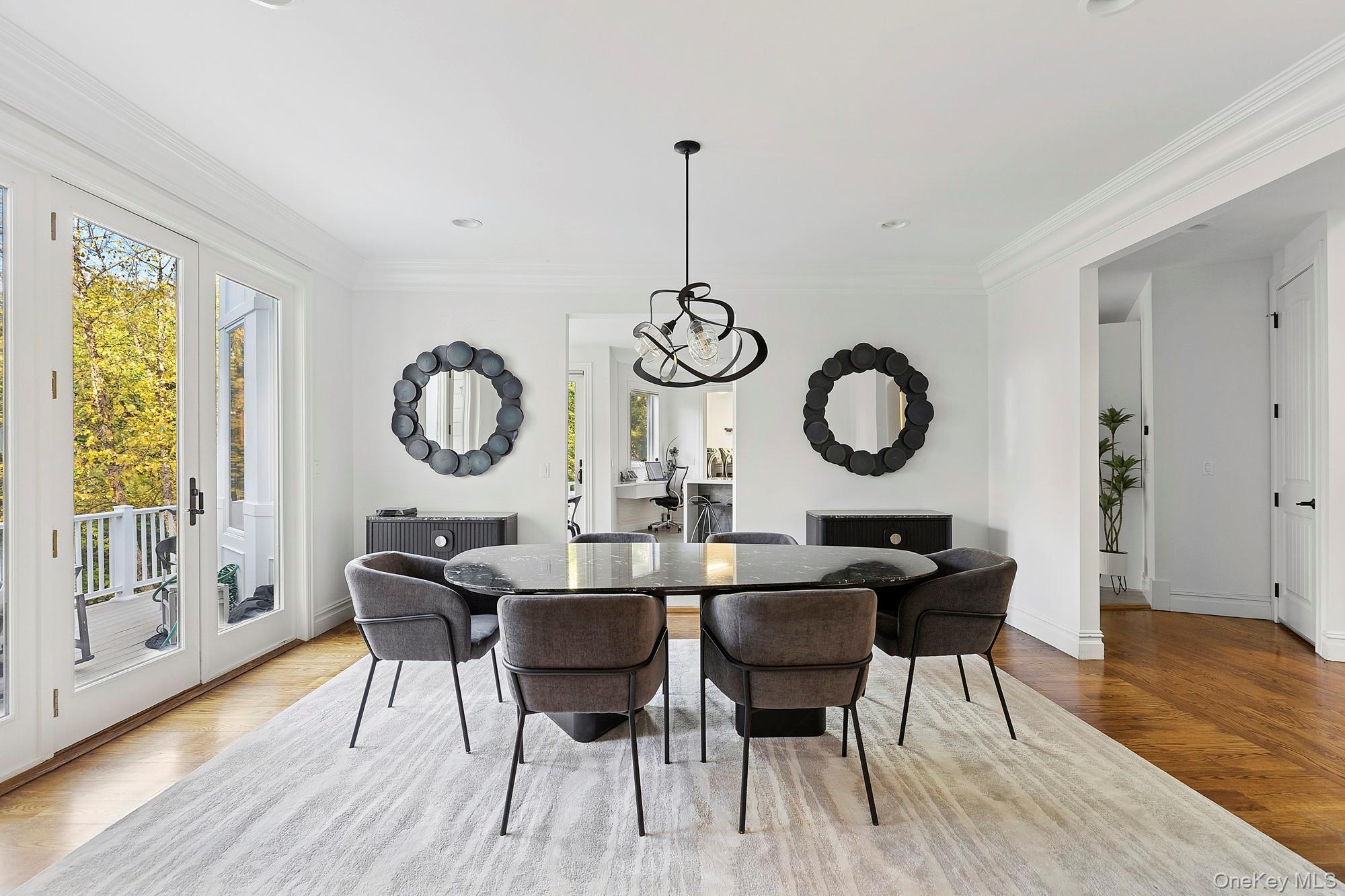 144 Round Swamp Road Huntington, NY 11743 - Photo 17 of 39 a dining room with wooden floor a glass table and chairs